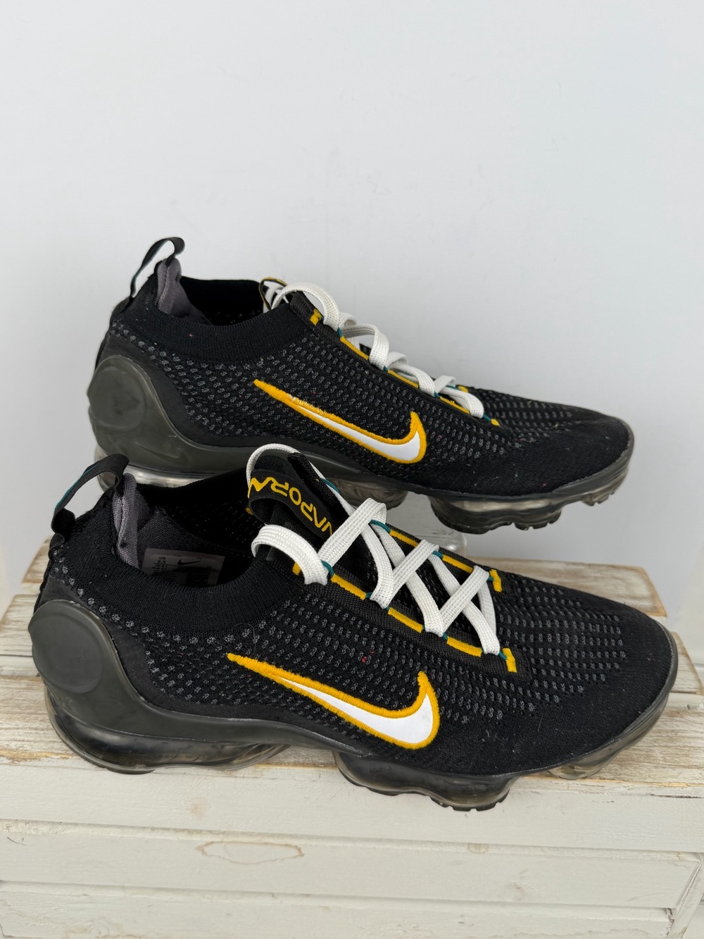 Nike Air VaporMax 2021 Flyknit sneakers in Black/University Gold color way 9.5